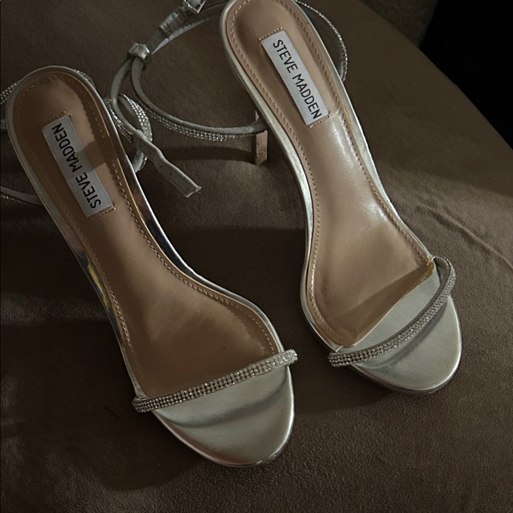 Like new worn once . Steve Madden Metallic Silver rhinestone Heels